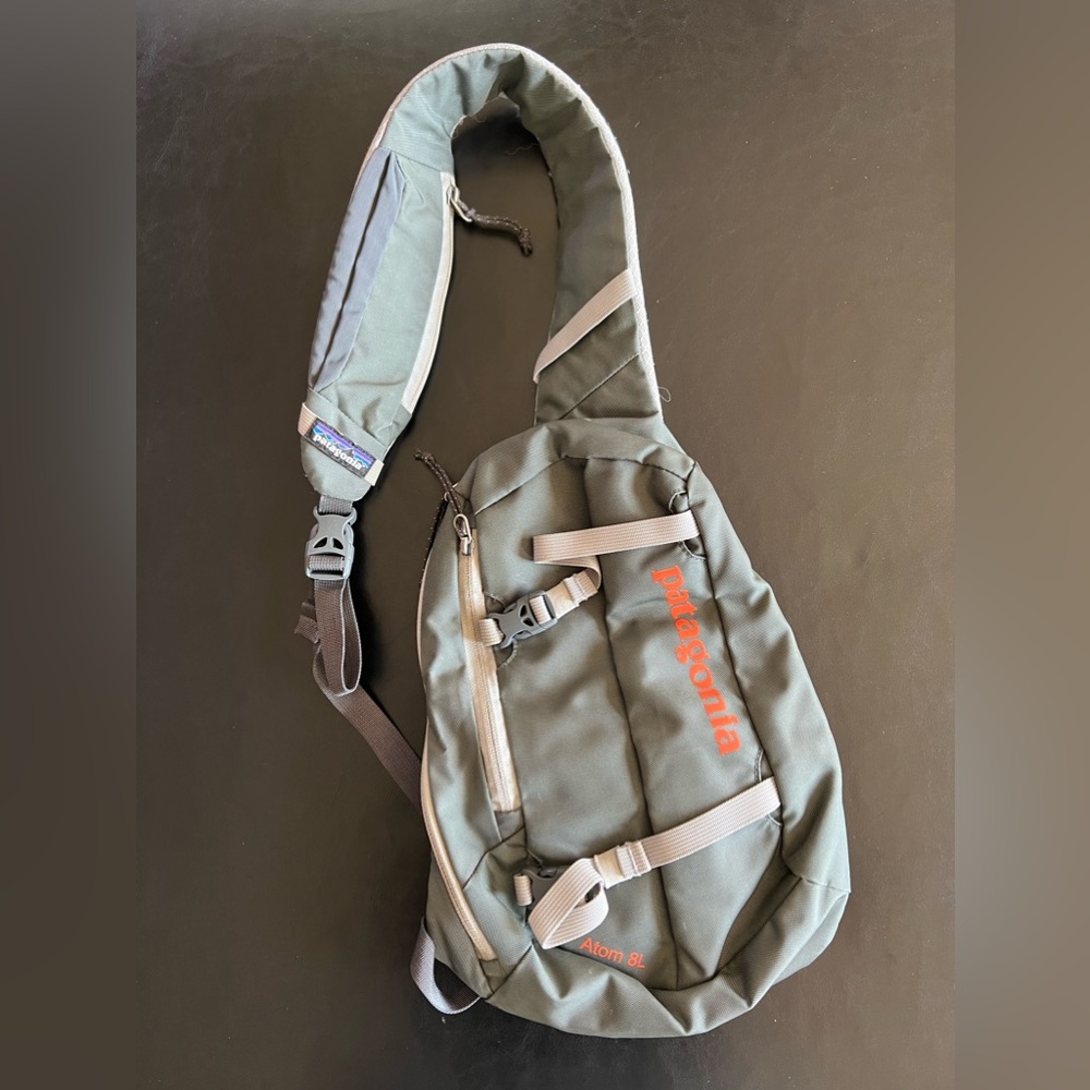 Patagonia Green Sling Backpack with Orange Accents